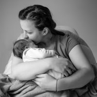 Mother holding her newborn baby